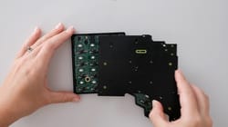 Voyager from the top. PCB Cover being gently placed in the shell